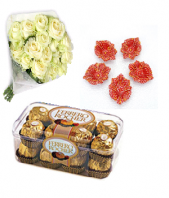 Luxury white roses with sweet Ferrero Rocher 16 pc and Designed Earthen Diyas Gifts toIndia, Combinations to India same day delivery