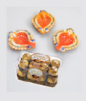 Orange Diyas and Ferrero Rocher 16 pc Gifts toBenson Town, Combinations to Benson Town same day delivery