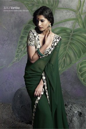 Bottle green saree with heavy embroidery blouse. 